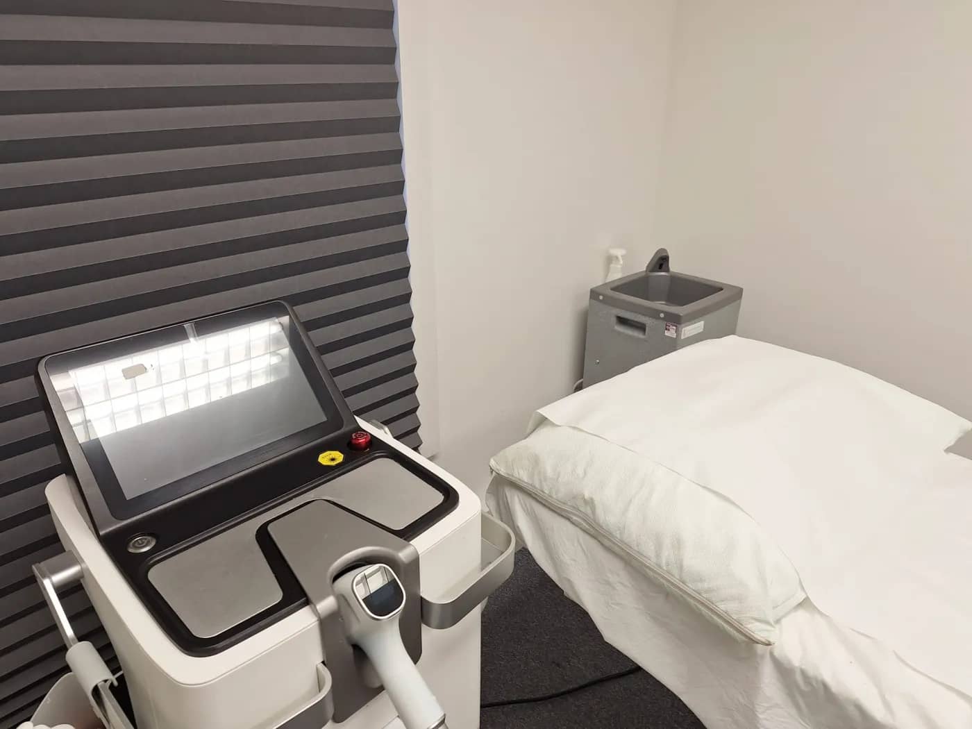 The diode laser beside the treatment bed in the laser room at Laserlite Clinic The diode laser beside the treatment bed in the laser room at Laserlite Clinic